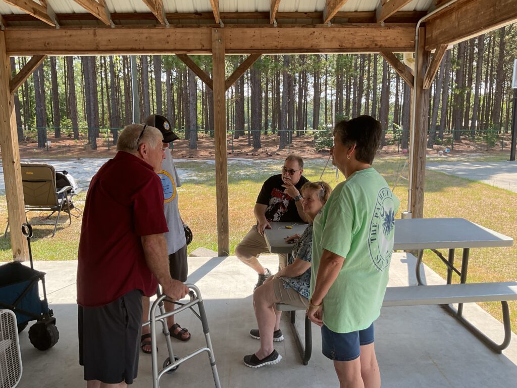 Amateur radio operators talking at club field day, 2024.