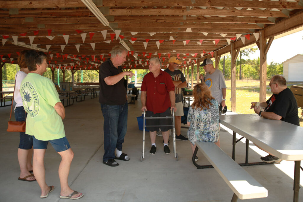 Amateur radio operators talking at club field day, 2024.